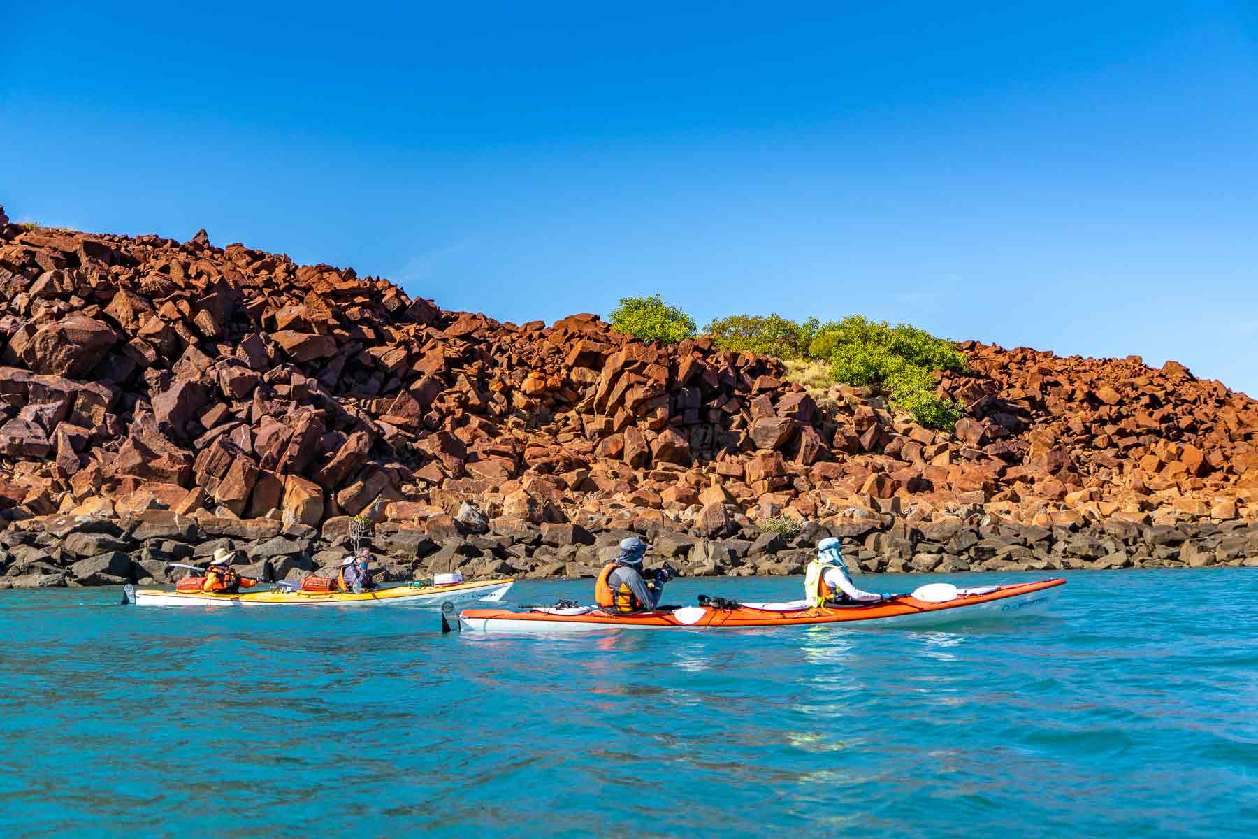 Sea kayaking amongst a natural rock pile, adorned with ancient petroglyphs